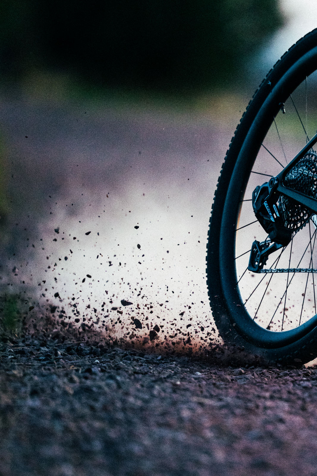 Rear wheel of the Callis 32 kicking up gravel